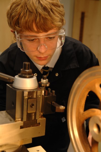 James Davies of Newcastle, Staffordshire in the JCB Academy's machine shop which is home to GBP1 million worth of engineering equipment at the new school.