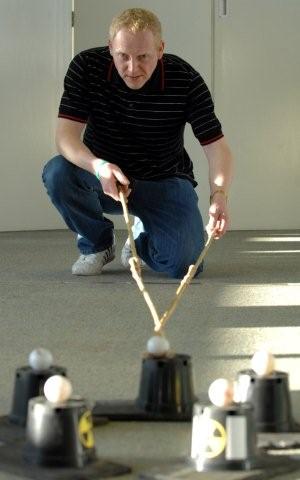 JCB machinist Peter Wilkes takes part in a team building exercise during the JCB training initiative