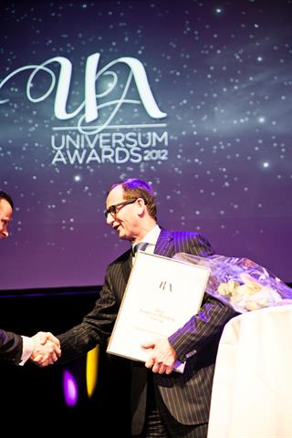 Hans van Leeuwen, TMHE's executive vice president of market operations, receives the award on behalf of his company.