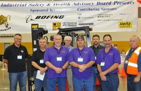 From left are Simon Larkin and Rob Vetter, both with IVES Training Group; Mike Weinman with Boeing Co; Stan Howard of Stellar Safety Supply; Mike McAllister of Boeing; Tim Eacrett of Boeing; Doug Graham of Boeing; and Joe Camacho of Papé Material Handling.