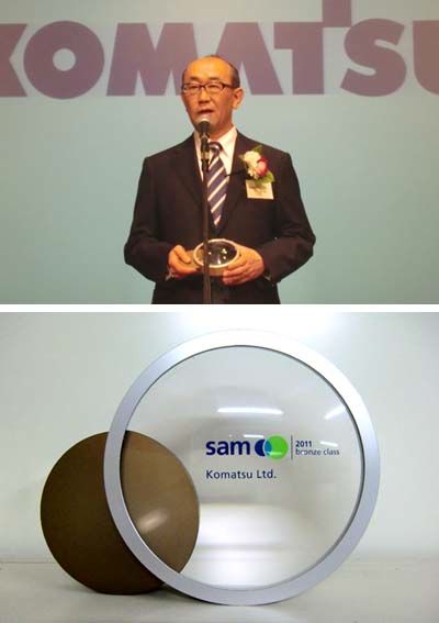 (top) Komatsu Ltd chief financial officer Mikio Fujitsuka giving a speech at the 25 August awards ceremony.