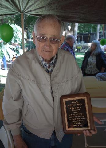 Bill Bolin with plaque recognising his 52 years with Lift Truck Center Inc