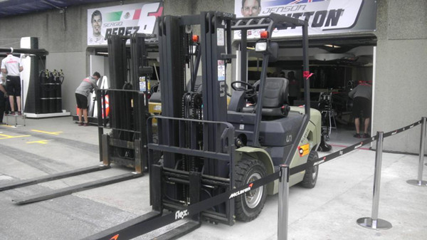 UN forklifts played a crucial role loading and unloading the containers in which the precious racing cars were transported. - Click for larger view