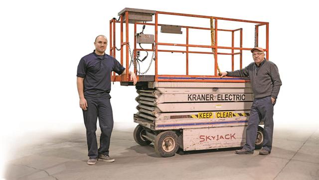 Matthew Kraner, left, and his father, Peter Kraner, with their Skyjack SJ-006-10 serial number 00E