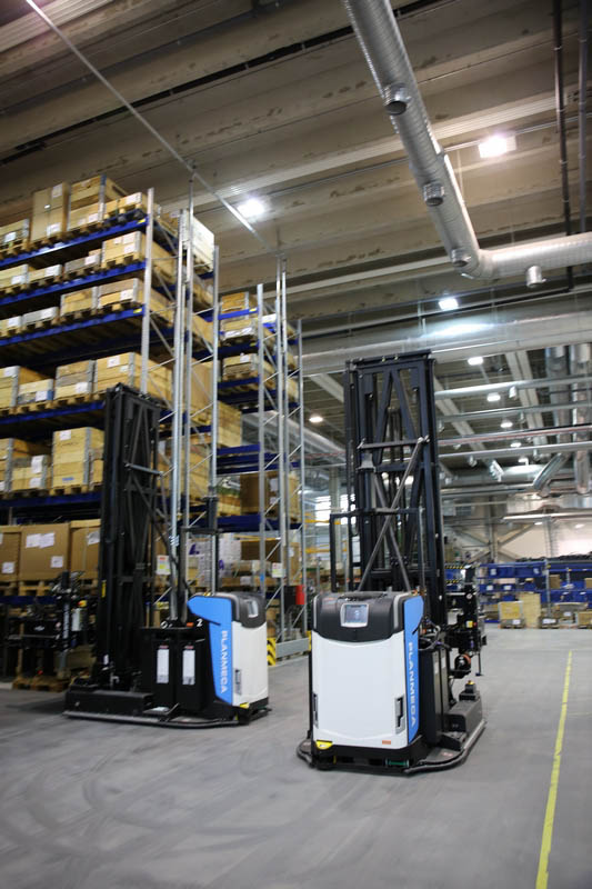 On a busy day the AGVs are moving between the conveyor, shelves and the tooling and painting units almost all the time. Click for larger image