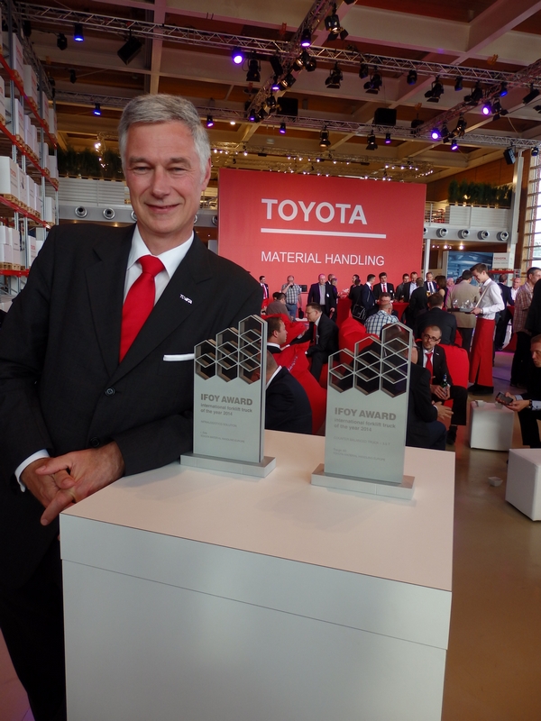 Matthias Fischer, CEO and president of TMHE, with Toyota's IFOY awards