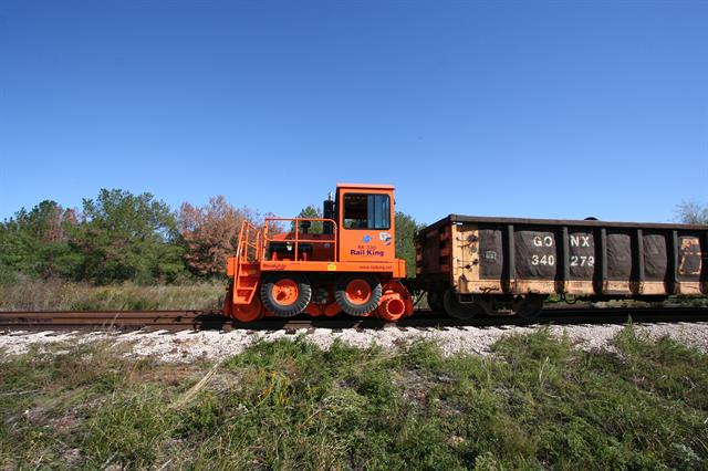 A Stewart & Stevenson Rail King RK 330 G5 railcar mover during an on-rails test pull.