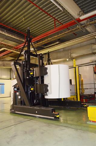 Rocla's automated guided trucks are effective workers and bring back the investment in a few years. Click for larger view.