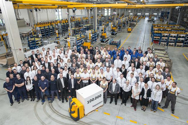 Staff celebrating the production of the 100,000th vehicle at the Landsberg plant.