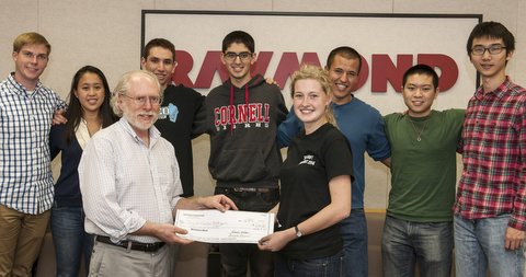 Raymond's Steve Medwin (left) presents USD1,000 to a Cornell engineering school
