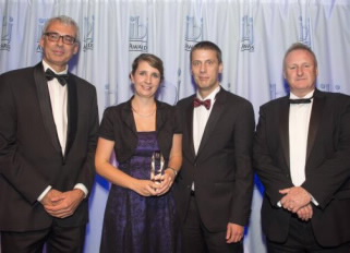 Dr Jörg Müller (second from the right), senior manager product management and Kathrin Feger (second from the left), contract manager at Terex Port Solutions, accept the IBJ Award in the Crane of the Year category.