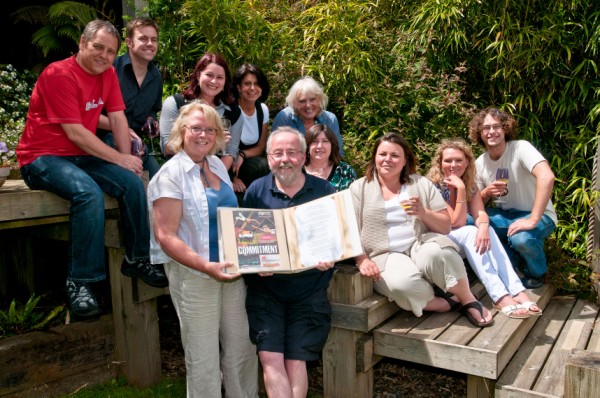 Staff present directors John and Marie Knowles a book containing messages from customers and contacts spanning the company's 25-year history.