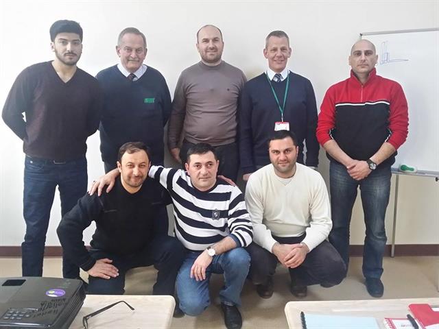 Lech Kluck, one of AITT's monitoring officers (far left) with a team of instructors. Managing director of TCS, Anar Malikbeyli is on the far right.