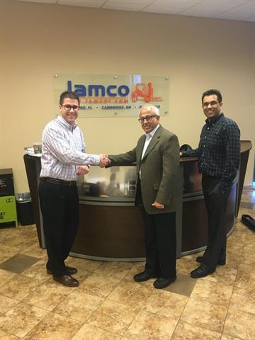 Doosan's Lyndle McCurley with Abbas Jamal and Tim Jamal of Jamco.