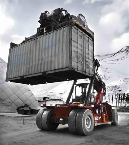 A Taylor Machine Works reach stacker performing cold weather duty.