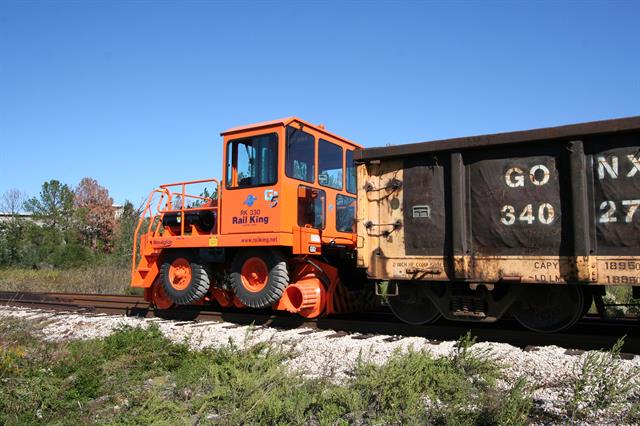 A Stewart & Stevenson Rail King RK 330 G5 railcar mover at work.