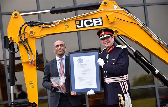 JCB's Buta Atwal receives the honours from HM Lord-Lieutenant of Staffordshire Ian Dudson