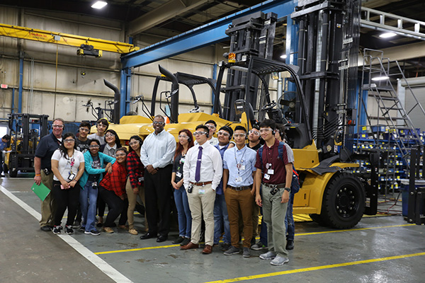 Students from Northbrook High School get an up-close view of the forklift frame fabrication line while touring the MCFA campus.