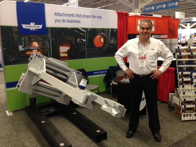 Global Product Manager Greg Nagle at Forge Fair with a Cascade Forge Clamp