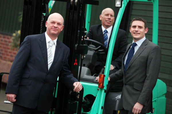 (L to R) LBMH directors Neil Farrimond and Greg White are welcomed to Mitsubishi Forklift Trucks UK by regional manager Martyn Davies.