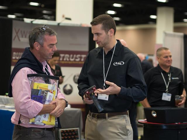 Logistics professionals discuss new products and services in the innovative Solutions Center.