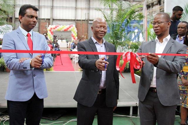Amanlal Kumkaran (Kalmar), Themba Gwala and Thamsanqa Jiyane (Transnet) celebrate the new delivery.