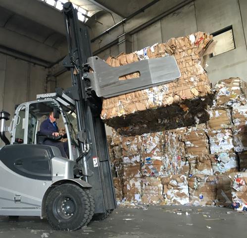 Waste paper bale handling.