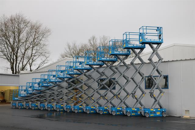 Lèbre's delivery line-up of 14 Genie GS-1932 scissor lifts ready for cold-storage installation
