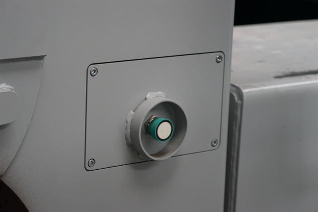 The truck is guided to the racks with the help of guidance wheels and ultrasound sensors attached to the side of the vehicle.