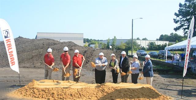 Kalmar executives break ground with civic leaders and representatives of developer Landmark Enterprises.