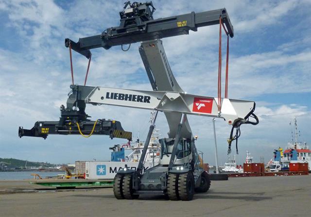 A Liebherr LRS 545 reachstacker assembling its six companions in Durban Port, South Africa