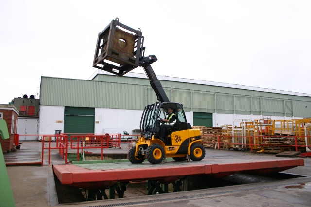 JCB design engineer John Sketchley putting the latest Teletruk through Tilit-Table sign-out at JCB's worldwide research and development centre UK. This model is a TLT 35D 4x4 able to lift 3.5 tonnes.