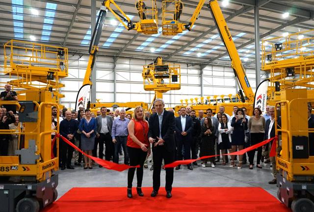 Natalie Reynolds and Haulotte CEO Alexandre Saubot cut the ribbon