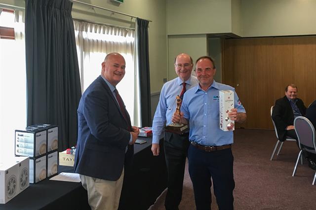 Nathan Sheritan of Crown Lift Trucks (right) collects the Individual Men's prize from FLTA president Andrew Woodward (left) and BITA secretary general James Clark (centre)