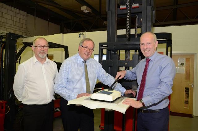 F-TEC's Kevin Bentham and Karl Baum celebrate with MP Justin Tomlinson