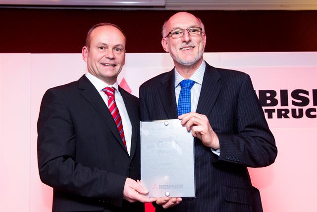 Managing Director of Alto Handling (right), receives the Mitsubishi Gold Award from Stewart Gosling of Red Diamond Distribution which has acquired the Alto business