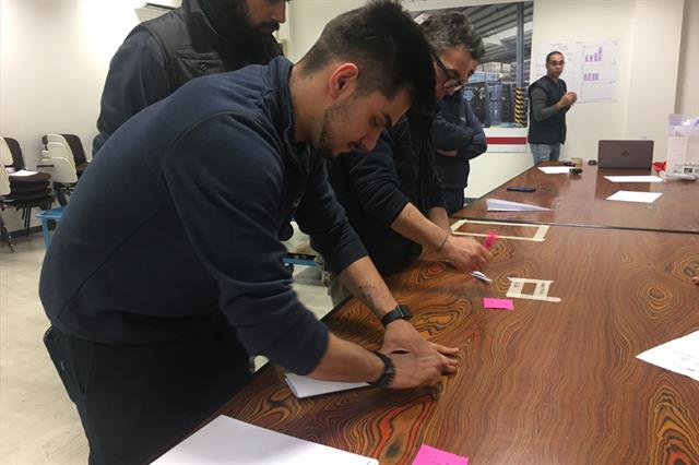 Bolzoni SpA production premises: workers take part to the ''Lean Simulation'' workshop.