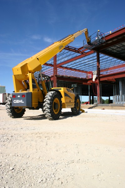 A Gehl telehandler with a personnel basket attachment.