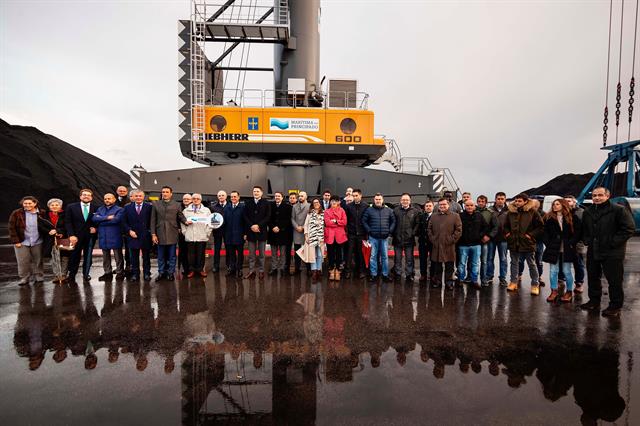 Company representatives and employees receive the new crane in Gijon, Spain