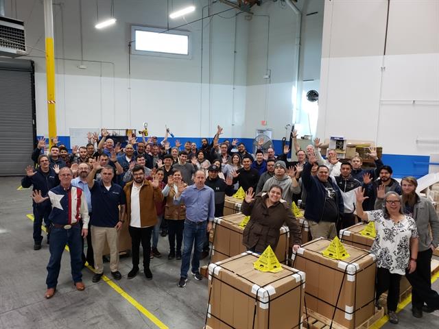 Flux Power employees celebrating the milestone