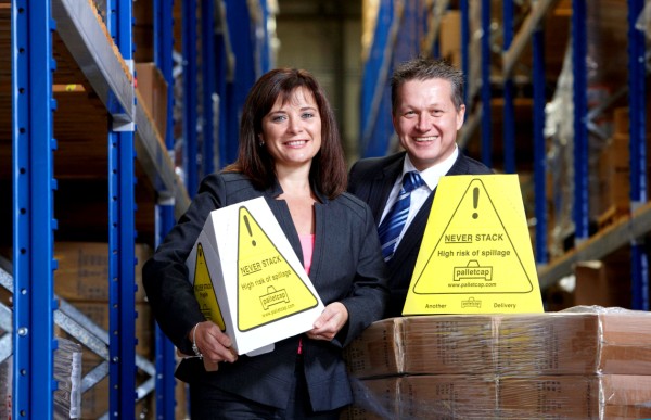 (L-R) Palletcap inventor Hayley Shirley demonstrates the cost-effective new Eco-Cap to long time customer Andy Mitchell.