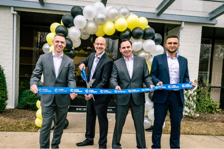 Cutting the ribbon at the new site