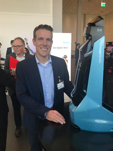 Toyota's Holger Urbschat with a model of the Ultralifter