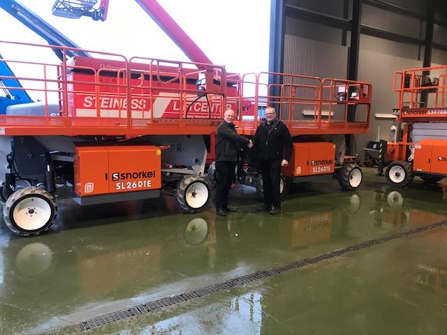 Karsten Haahr, of KH Lift ApS (left) hands over the Electric Speed Levels to Poul Steiness of Steiness Liftcenter