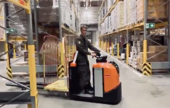 Racing driver switches to forklift for pandemic relief