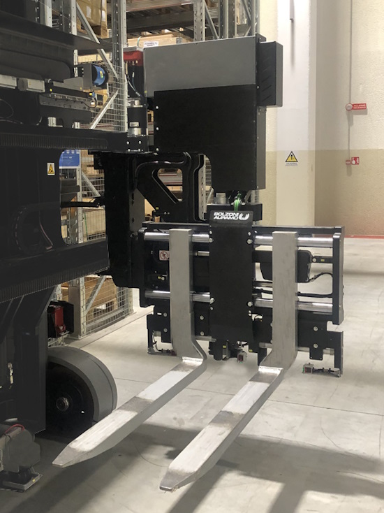 Bolzoni trilateral head for VNA allows the AGV to travel straight down an aisle and to handle load from one side of the vehicle to the other without steering, maximizing warehouse space and operational time.