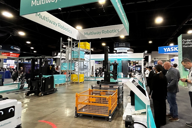 Onlookers watch Multiway's AGV forklifts operating in real time.
