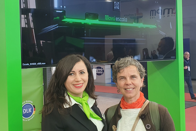 Diana Davoyan at Movu Robotics gives Ann a demo of their pallet-to-person shuttle.