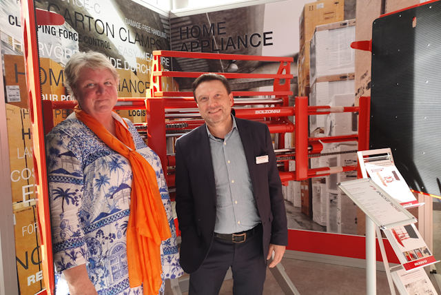 Barbara Adam and Bolzoni Global Marketing Director Carlo Fallarini nestled inside their Home Appliance Telescopic Clamp.