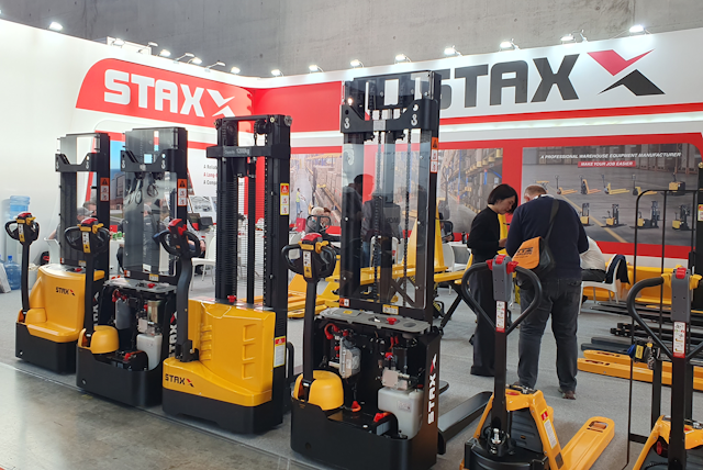 At the STAXX stand with visitors  wander through their range of electric powered pallet trucks and stackers.